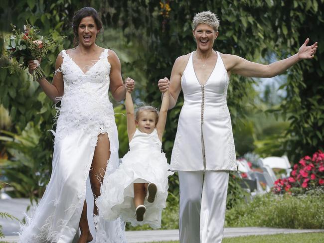 Sarah Maxwell and her wife Natalie Cook with their daughter, Jordan, at their wedding at Secrets at Montville, on the Sunshine Coast.  Picture: Nathan Richter