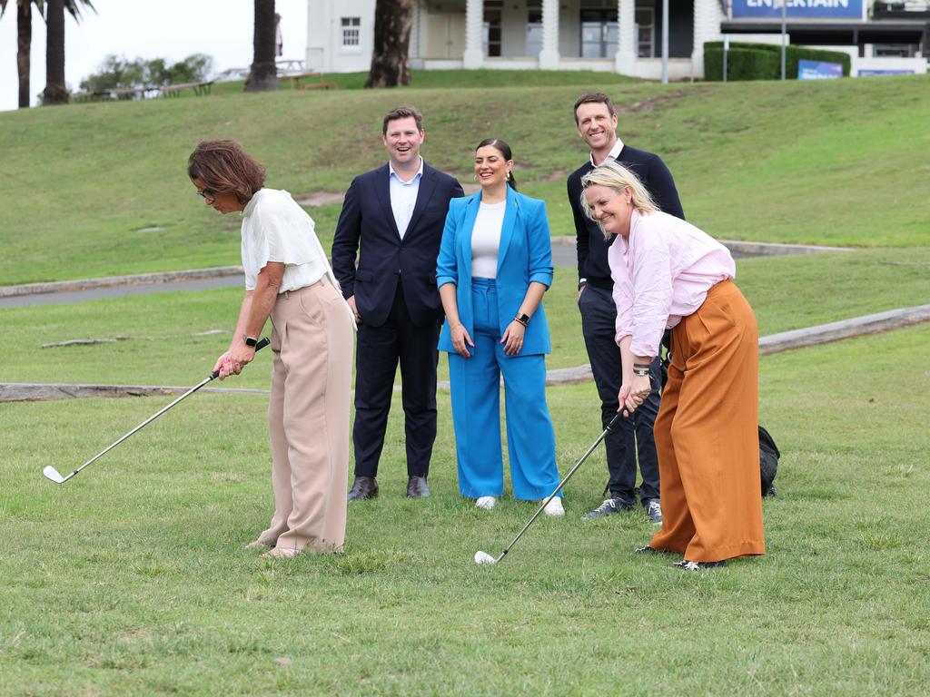 Liberal candidate for Wentworth Ro Knox (right) swinging for an electoral hole-in one. Picture: Rohan Kelly