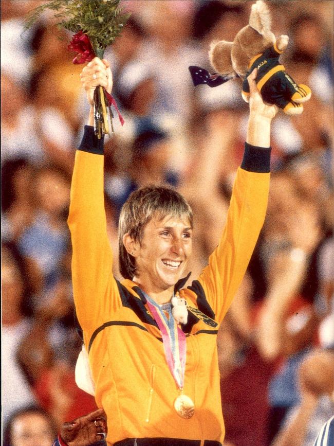 Athlete Glynis Nunn on dais winning gold medal after competing in Heptathlon event at 1984 Olympics in Los Angeles.