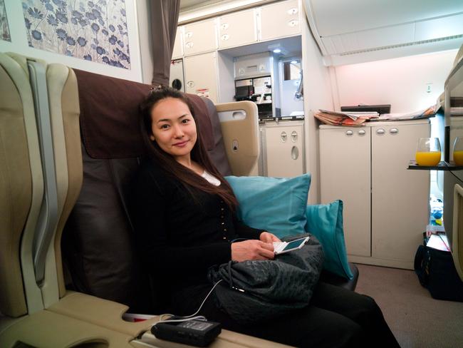 We want one of these! Living it up in business class on Singapore Airlines. Picture: Jo Ito