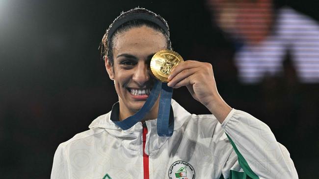 Gold medallist Algeria's Imane Khelif poses on the podium at the Paris Olympics. (Photo by MOHD RASFAN / AFP)