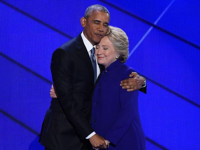 US President Barack Obama and Democratic presidential nominee Hillary Clinton embrace on stage during Day 3 of the Democratic National Convention at the Wells Fargo Center, July 27, 2016 in Philadelphia, Pennsylvania. Picture: AFP PHOTO / SAUL LOEB