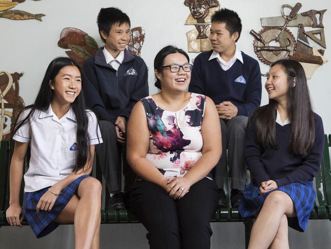 06/03/2018: (L-R) Year 10 high achievers Rebecca Huynh, 15, Robert Bui, 16, literacy teacher Rhianna Lim, Sean Huynh, 14, and Sally Tran, 14. Canley Vale High School in Sydney's South-west has emerged as one of the long-term improvers in NAPLAN, posting above-average gains in literacy and numeracy since 2014. This is despite 96 per cent of the school's students coming from non-English-speaking backgrounds. The school attributes its success to running separate literacy classes for years 7 to 9. Hollie Adams/The Australian