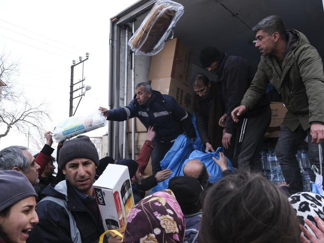 A group of volunteers deliver water, heaters, blankets and hygiene products to local people in Elbistan Turkey. Picture: Getty Images