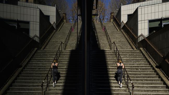 Sydney CBD woman runs the Windmill Stairs The Rocks