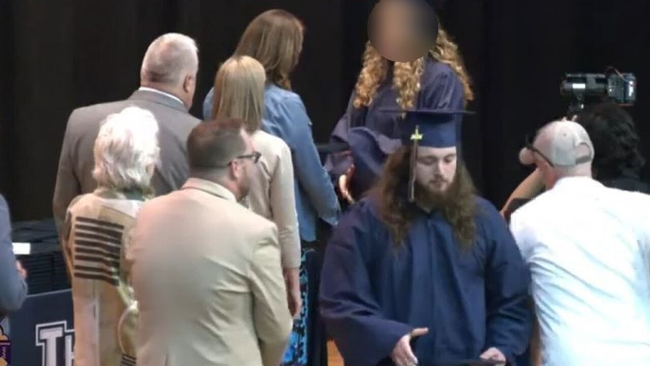 Mr Eddy’s daughter was receiving her diploma when he rushed to the stage. Picture: YouTube@MAXTVBARABOO