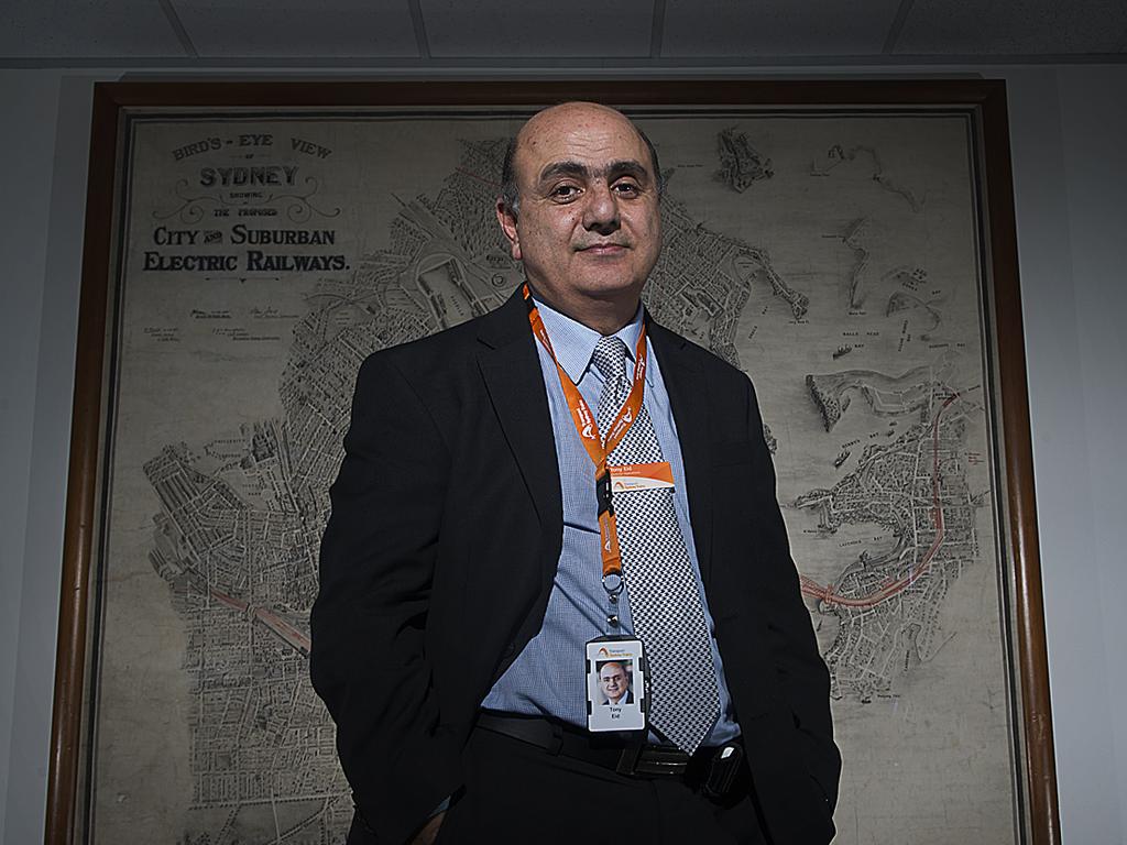 Tony Eid, Director of Operations for Sydney Trains, stands on in front of a historic hand drawn map of Sydney's transport system. Photos: Chris McKeen