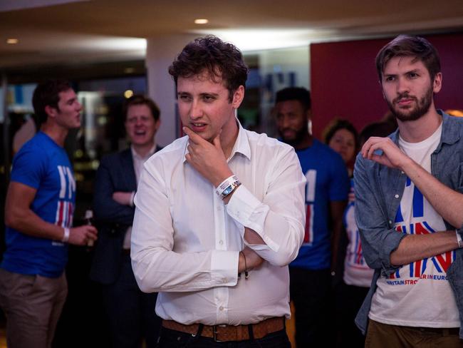 Concerned expression fom two classically British-looking young men at the Stronger In Campaign results party at the Royal Festival Hall in London.