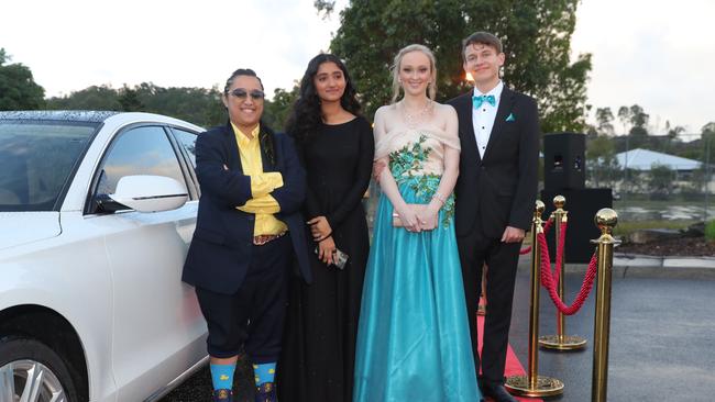 Pacific Pines High formal, at the school. Azriel Pereniko, Shruti Phogat, Dayna Wise & Lachlan Wilson Picture Glenn Hampson