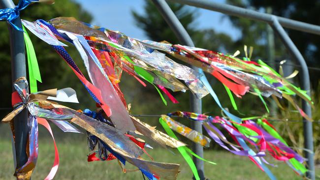 RIbbons on a Loud Fence at Park Orchards for the victims of sexual abuse by Barry Watson.