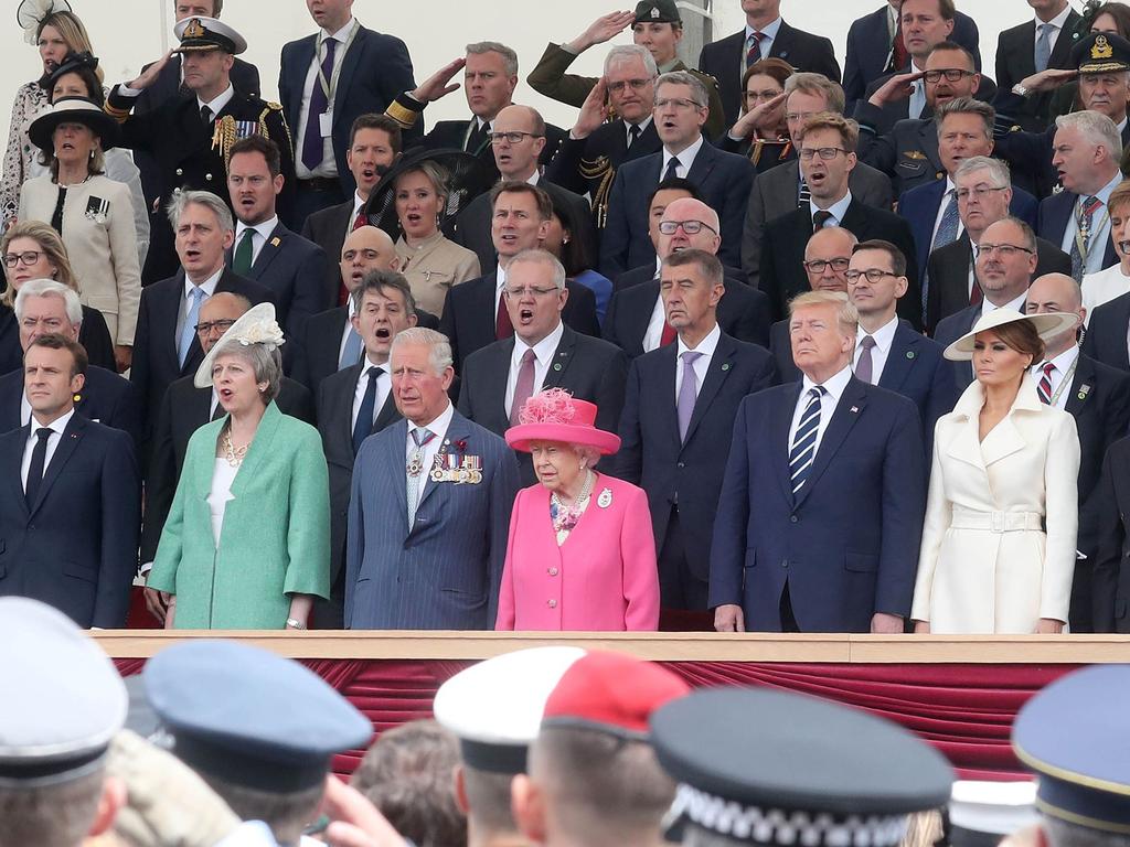 The leaders rise together with Australian Prime Minister Scott Morrison seated behind the Queen. Picture: Chris Jackson / AFP.