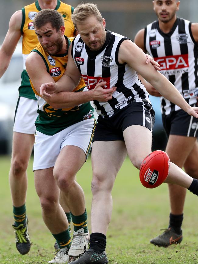 Salisbury North’s Brad Johansen tackles Payneham Norwood Union’s Tyson Burrows. Picture: Calum Robertson