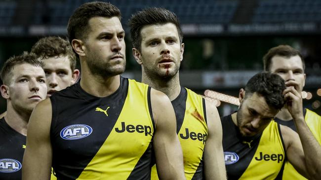 MELBOURNE, AUSTRALIA - JULY 01: Dejected Richmond players walk from the ground after the round 16 AFL match between the Gold Coast Suns and the Richmond Tigers at Marvel Stadium on July 01, 2021 in Melbourne, Australia. (Photo by Darrian Traynor/Getty Images)