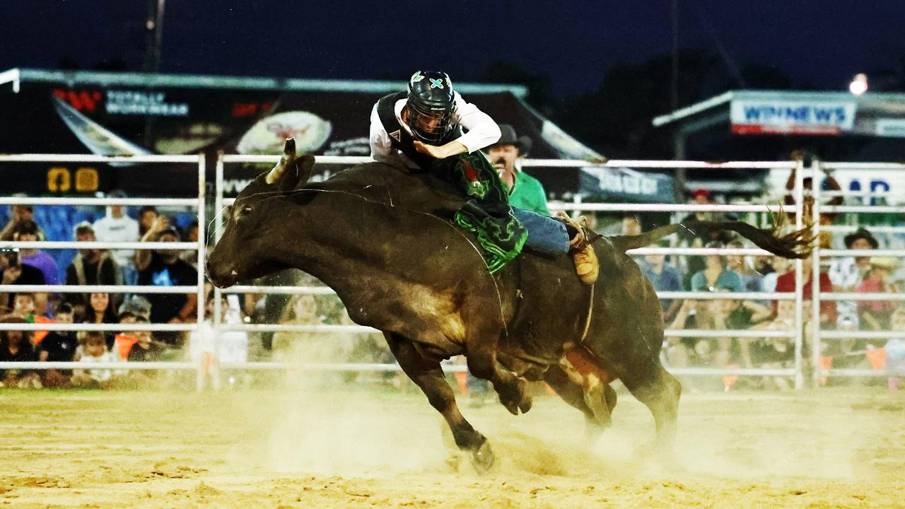 Corey Mitchell competes in the novice bull ride at the 2024 Cairns Bull Throttle event, a bikes and bulls show, featuring bull riding and freestyle motocross riders at the Cairns Showgrounds. Picture: Brendan Radke