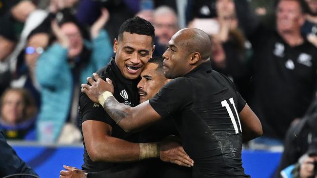 Aaron Smith (C) celebrates with teammates after scoring a try which was later disallowed. Picture: Getty