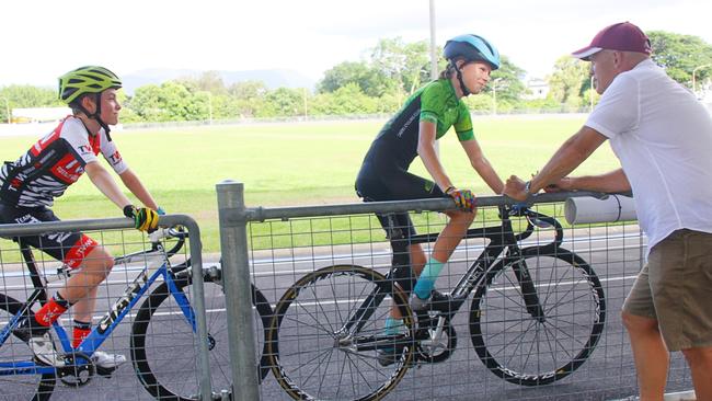 Cairns Cycling Club juniors Will Emeleus and Chloe Buckley listen as head coach Richie Bates advises the pair on racing strategy ahead of the pair competing at the national junior track titles in Brisbane in March 2022. Picture: Alison Paterson