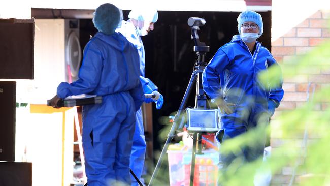 Police at the Markwell Avenue scene where Dre Nova was found dead on Friday. Picture: Adam Head