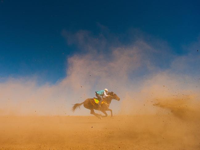 Last Place at Brunette Downs: The last place runner at theNorthern Territory's oldest race meeting on Brunette DownsStation, photography by Glenn Campbell