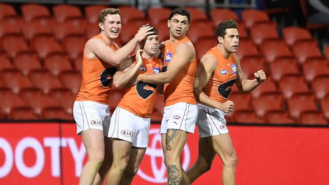 GOLD COAST, AUSTRALIA – JULY 25: Brent Daniels of the Giants celebrates kicking a goal during the round 19 AFL match between Essendon Bombers and Greater Western Sydney Giants at Metricon Stadium on July 25, 2021 in Gold Coast, Australia. (Photo by Albert Perez/AFL Photos/via Getty Images)