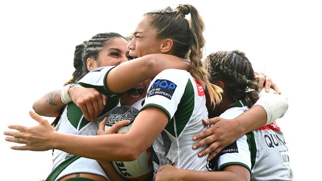 Zali Fay of the Maori All Stars celebrates scoring a try.