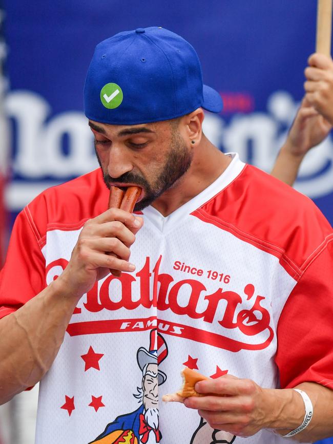 Competing in the 2023 Nathan's Famous International Hot Dog Eating Contest.