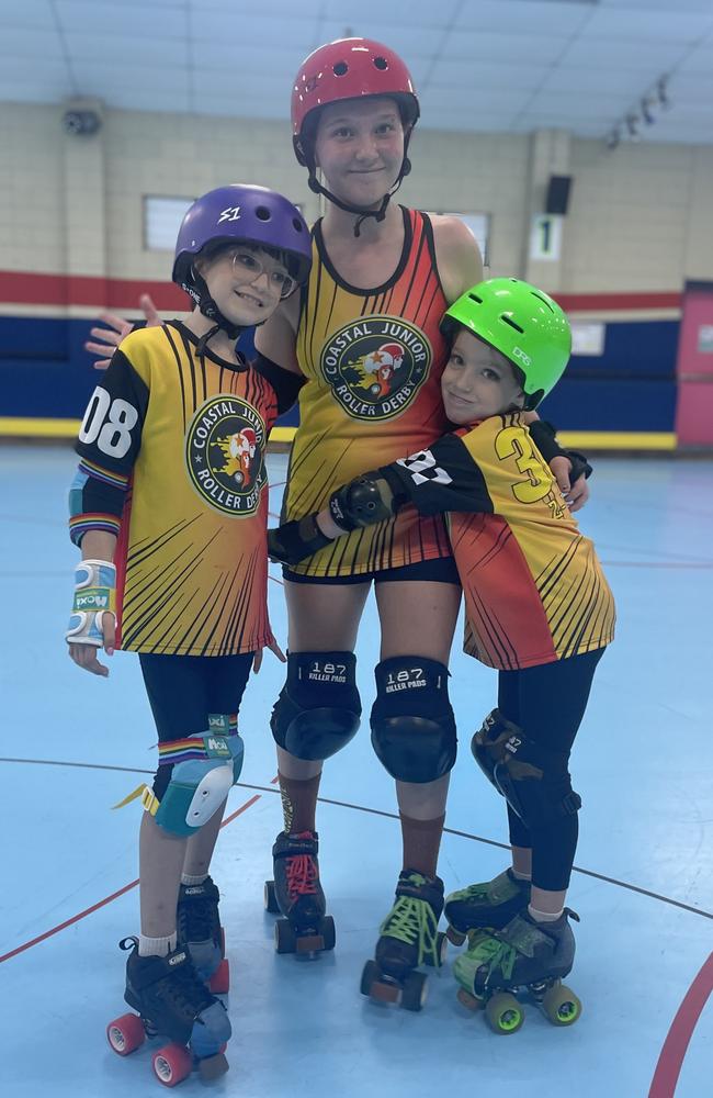 Keira Dascoli-Guymer (red helmet) with her sisters Elki (purple) and Ziani (green). Photos: Contributed