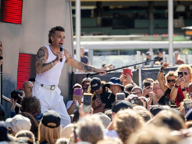 Williams performing his mini concert at Federation Square. Picture: Jason Edwards