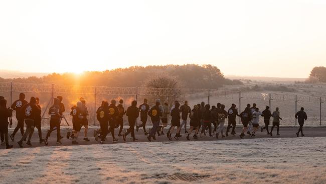 Australian Army soldiers from the 5th Battalion, Royal Australian Regiment, conduct morning physical training in the United Kingdom during Operation KUDU. Picture: File