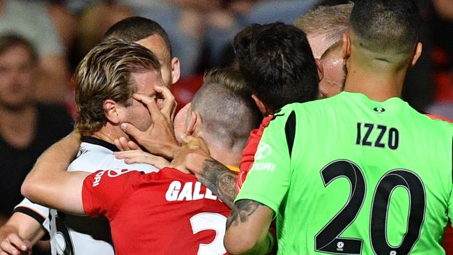 Players scuffle during the Round 6 A-League match between Adelaide United and Brisbane Roar at Coopers Stadium in Adelaide, Friday, November 30, 2018. (AAP Image/David Mariuz) 