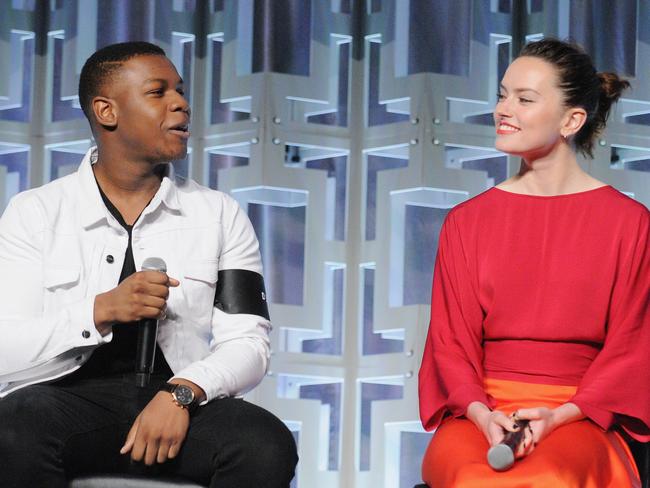 John Boyega with co-star Daisy Ridley on the Star Wars: The Last Jedi panel. Picture: Gerardo Mora/Getty Images for Disney