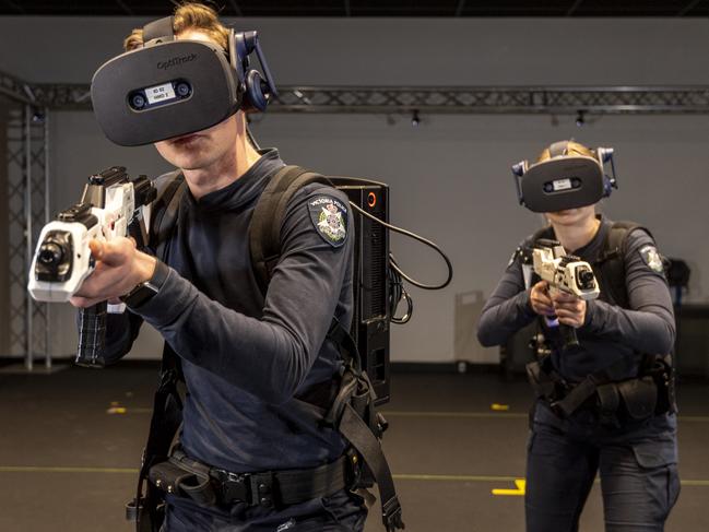 The Visual Reality (VR) simulation training at the Victoria Police Academy.Constable Jonah Carey (left) and Constable Alannah Lewis  during a train exercise utilising the Visual Reality training system currently in use during cadet training at the Victoria Police Academy at Glen Waverley.