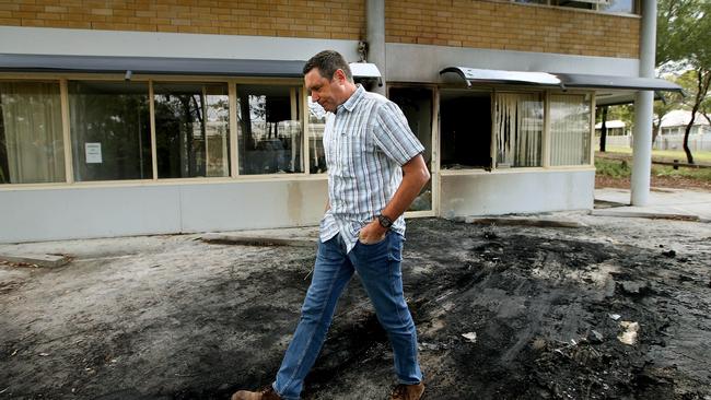 The Australian Christian Lobby’s Lyle Shelton inspects the damage after the explosion. (Pic: Kym Smith)