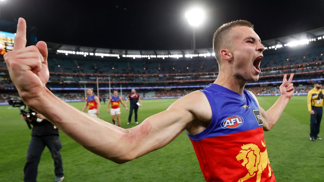 Darcy Wilmot whips the travelling Lions fans into a frenzy after knocking off Melbourne at the MCG during last year’s finals. Picture: Getty Images