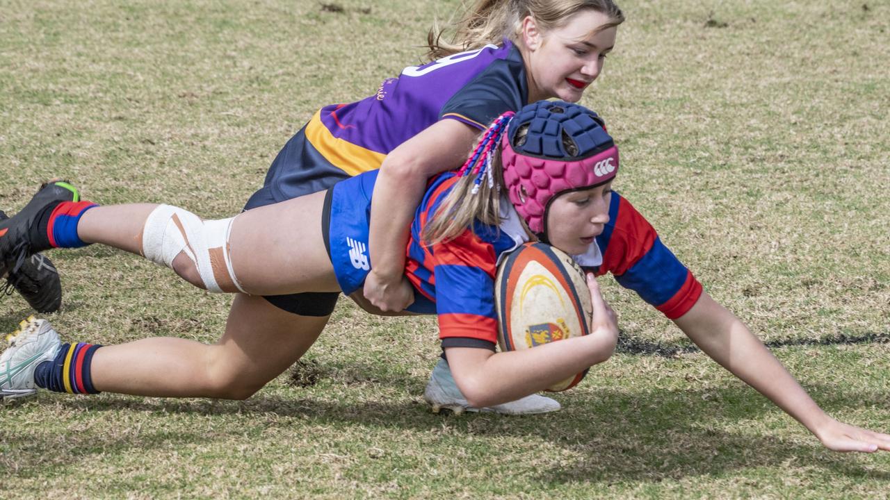 Hannah Nielsen for Downlands. Selena Worsley Shield game2. Girl's rugby 7s Downlands vs Glennie. Saturday, August 6, 2022. Picture: Nev Madsen.