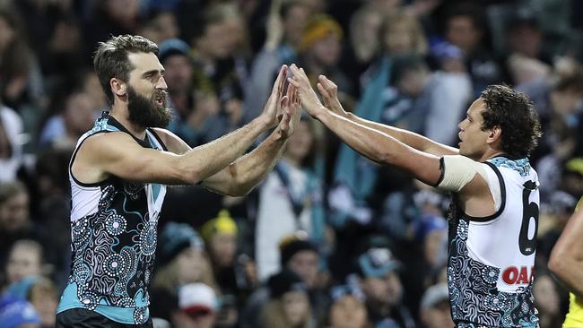 Justin Westhoff celebrates a goal with Steven Motlop. Picture: Sarah Reed