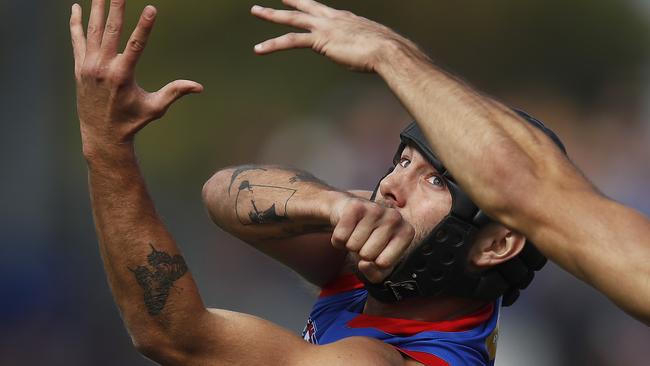 BALLARAT, AUSTRALIA - APRIL 10: Caleb Daniel of the Bulldogs handballs during the round four AFL match between the Western Bulldogs and the Brisbane Lions at Mars Stadium on April 10, 2021 in Ballarat, Australia. (Photo by Daniel Pockett/Getty Images)