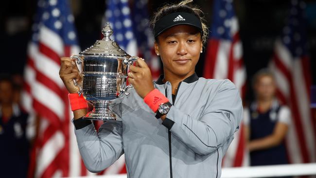 Naomi Osaka poses with the championship trophy after winning the US Open final. Picture: Getty