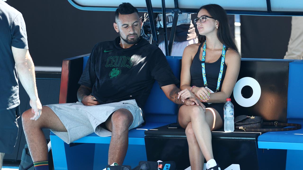 Nick Kyrgios takes a break from training with his girlfriend, Costeen Hatzi. Picture: Michael Klein