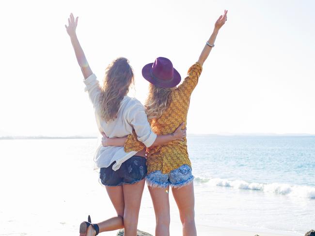 Two females arms raised on the beachcredit: Getty Imagesescape3 october 2021kendall hill