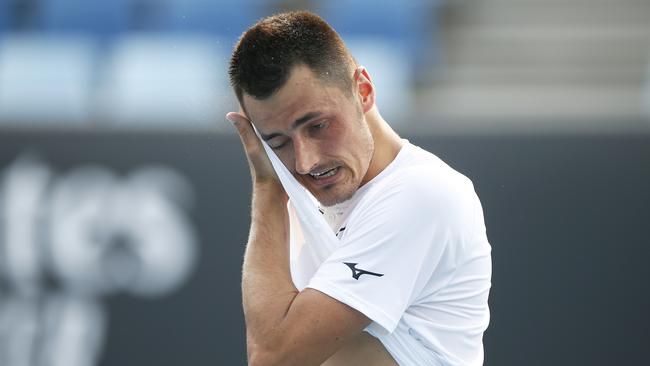 MELBOURNE, AUSTRALIA - JANUARY 14: Bernard Tomic of Australia reacts in his match against Denis Kudla of the USA during 2020 Australian Open Qualifying at Melbourne Park on January 14, 2020 in Melbourne, Australia. (Photo by Daniel Pockett/Getty Images)