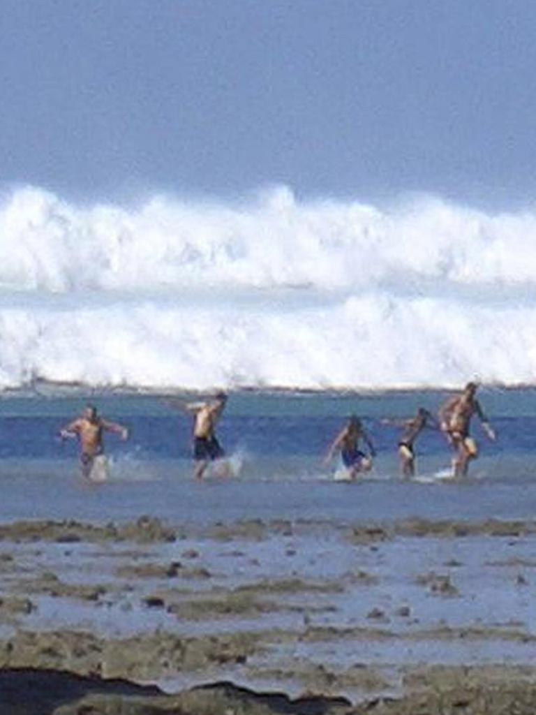 Tourists trying to escape the tsunami on Boxing Day, 2004. Picture: AFP / STR