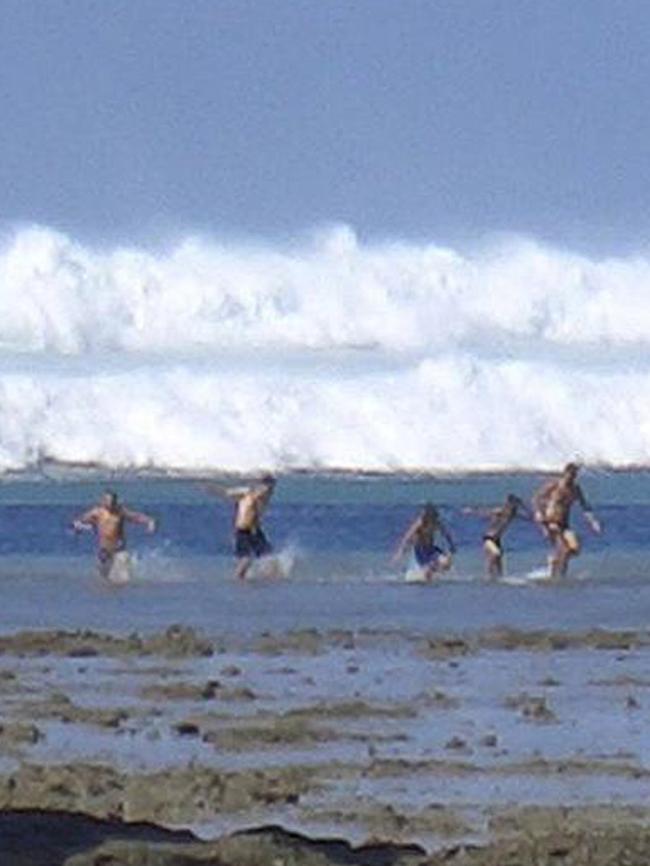 Tourists trying to escape the tsunami on Boxing Day, 2004. Picture: AFP / STR