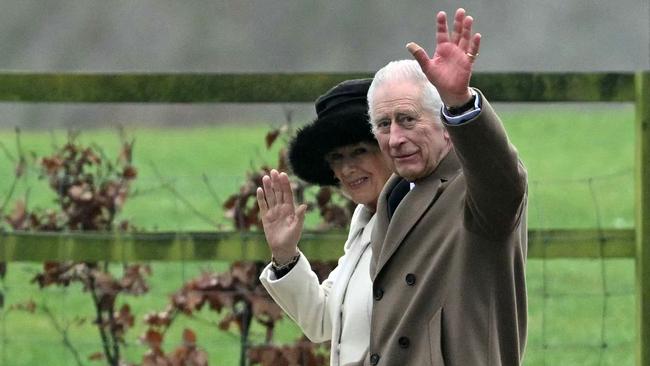 Britain's King Charles III and Britain's Queen Camilla waves as they leave after attending a service at St Mary Magdalene Church on the Sandringham Estate in eastern England on February 11, 2024. Picture: Justin Tallis/AFP