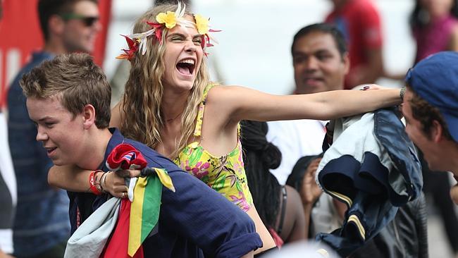 She's happy to hang out with mere mortals, like these guys at the Notting Hill Carnival. Picture: Splash