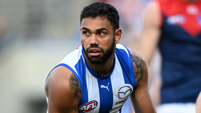 HOBART, AUSTRALIA - AUGUST 06: Tarryn Thomas of the Kangaroos runs the ball during the round 21 AFL match between North Melbourne Kangaroos and Melbourne Demons at Blundstone Arena, on August 06, 2023, in Hobart, Australia. (Photo by Steve Bell/Getty Images)