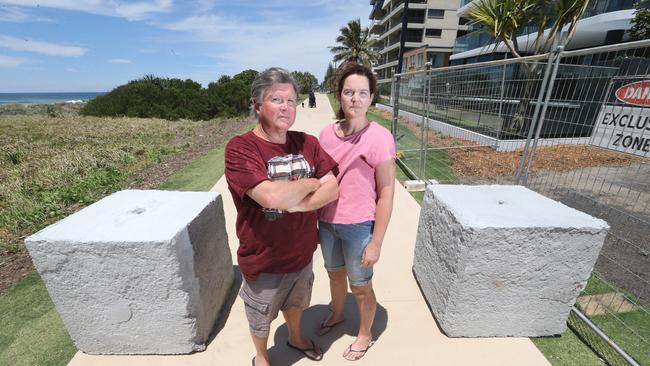 Bradley Daley and Natalie Zantvoort at the Oceanway at Palm Beach where Council have installed bollards to stop hoons driving at speed up the footpath. Picture: Richard Gosling