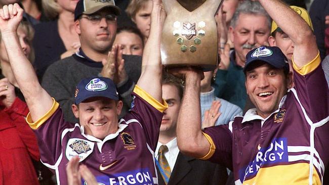 New Broncos coach Kevin Walters (left) and Gorden Tallis celebrate Brisbane’s premiership win in 2000.