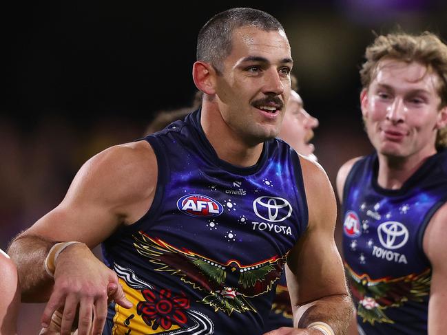 ADELAIDE, AUSTRALIA - MAY 26: Taylor Walker of the Crows celebrates a goal with team mates during the 2024 AFL Round 11 match between Kuwarna (Adelaide Crows) and Waalitj Marawar (West Coast Eagles) at Adelaide Oval on May 26, 2024 in Adelaide, Australia. (Photo by Sarah Reed/AFL Photos via Getty Images)