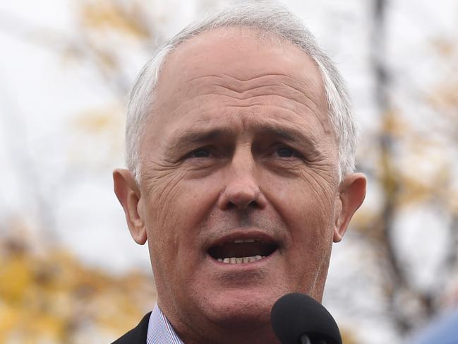 Prime Minister Malcolm Turnbull addresses a rally organised by owner driver trucking companies in Canberra, Sunday, April 17, 2016. Hundreds of truck drivers are expected to protest against the introduction of minimum payrates in Canberra over the next two days. (AAP Image/Lukas Coch) NO ARCHIVING