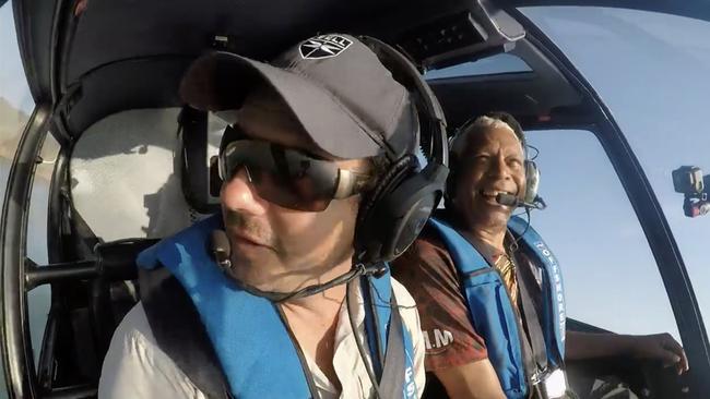 Troy Thomas flying with Ernie Dingo while filming Going Places with Ernie Dingo at Horizontal Falls. Picture: SBS.